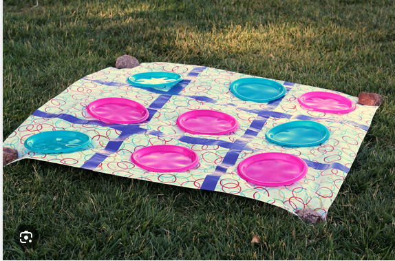 outdoor checkers set on a grassy lawn