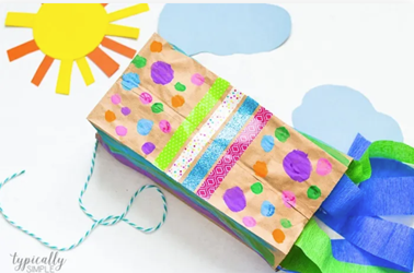 Brown paper bag decorated to look like a kite