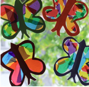 4 different colored suncatchers on a window.