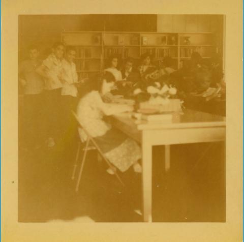 Photograph of individuals reading at Gretna Library, 1949