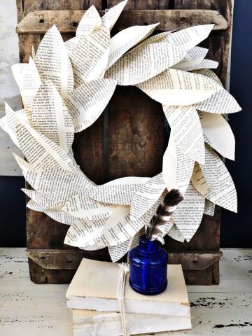 Wreath made from book pages hanging on door