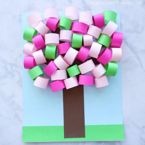 a picture showing a paper tree with pink, purple, and green rolled leaves