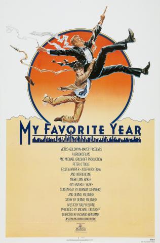A vintage-style movie poster for My Favorite Year shows two men in suits mid-air in a playful, exaggerated pose, as if jumping or falling together. One man wears a tuxedo and holds a cane, while the other clings to him. Behind them is a large orange circle resembling a sunset. Below, stylized text reads “My Favorite Year,” with a city skyline incorporated into the lettering. Film credits appear beneath the title.