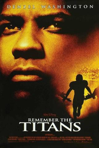 A dramatic movie poster for Remember the Titans features a close-up of a man’s face in warm golden tones dominating the background. In the foreground, a silhouetted football player runs forward holding a football. Text at the top reads “Denzel Washington,” and the title “Remember the Titans” appears near the bottom along with film credits.