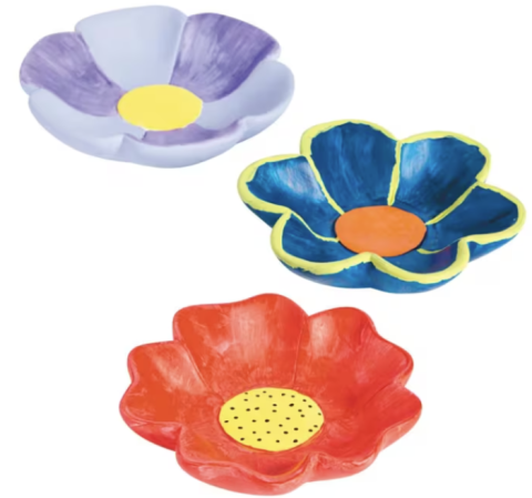 This picture is of three colorful ceramic bowls that are shaped like the tops of flowers.