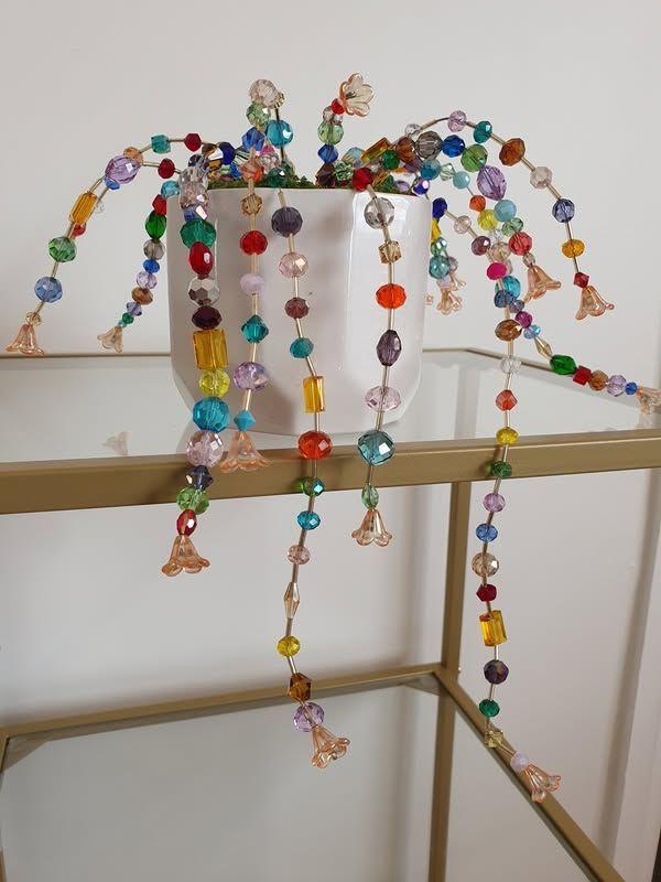 rainbow beaded fake plant in a pot